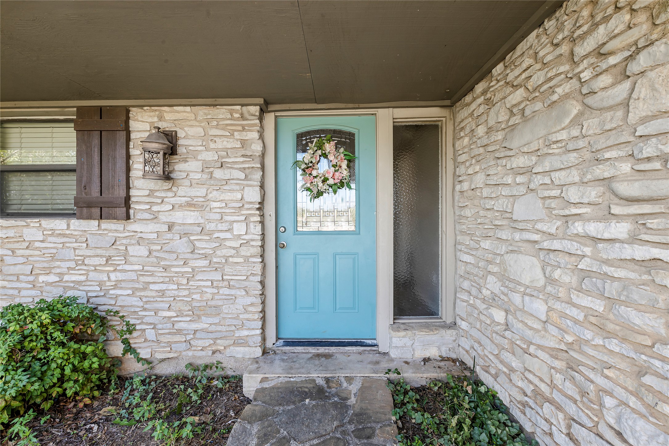 1401 Brazos Street Marble Falls, TX 78654 - Photo 3 of 23 Entrance to property featuring stone siding and covered porch