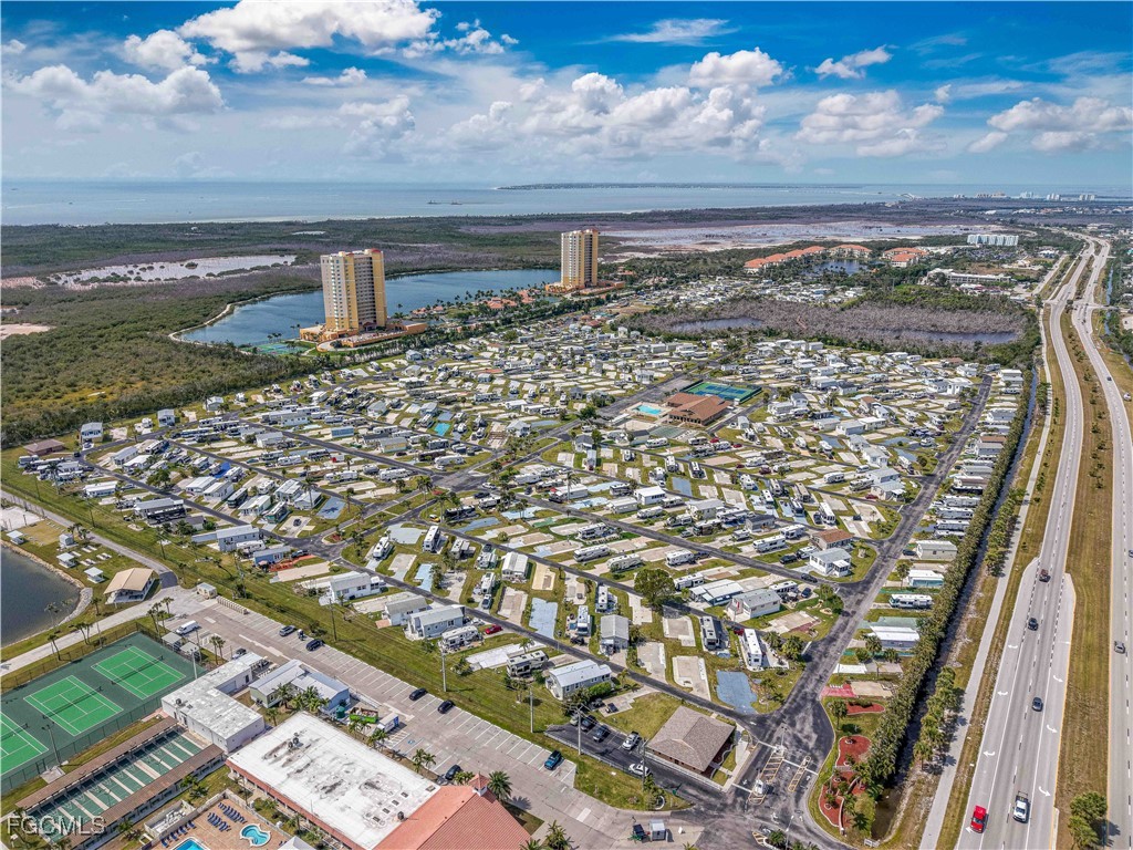 19681 Summerlin Road, Unit 273 Fort Myers, FL 33908 - Photo 16 of 16 a view of a lake with a building