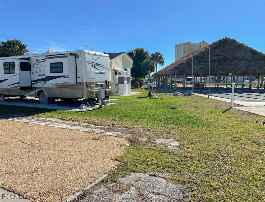 19681 Summerlin Road, Unit 273 Fort Myers, FL 33908 - Photo 6 of 16 a view of a house with backyard and sitting area