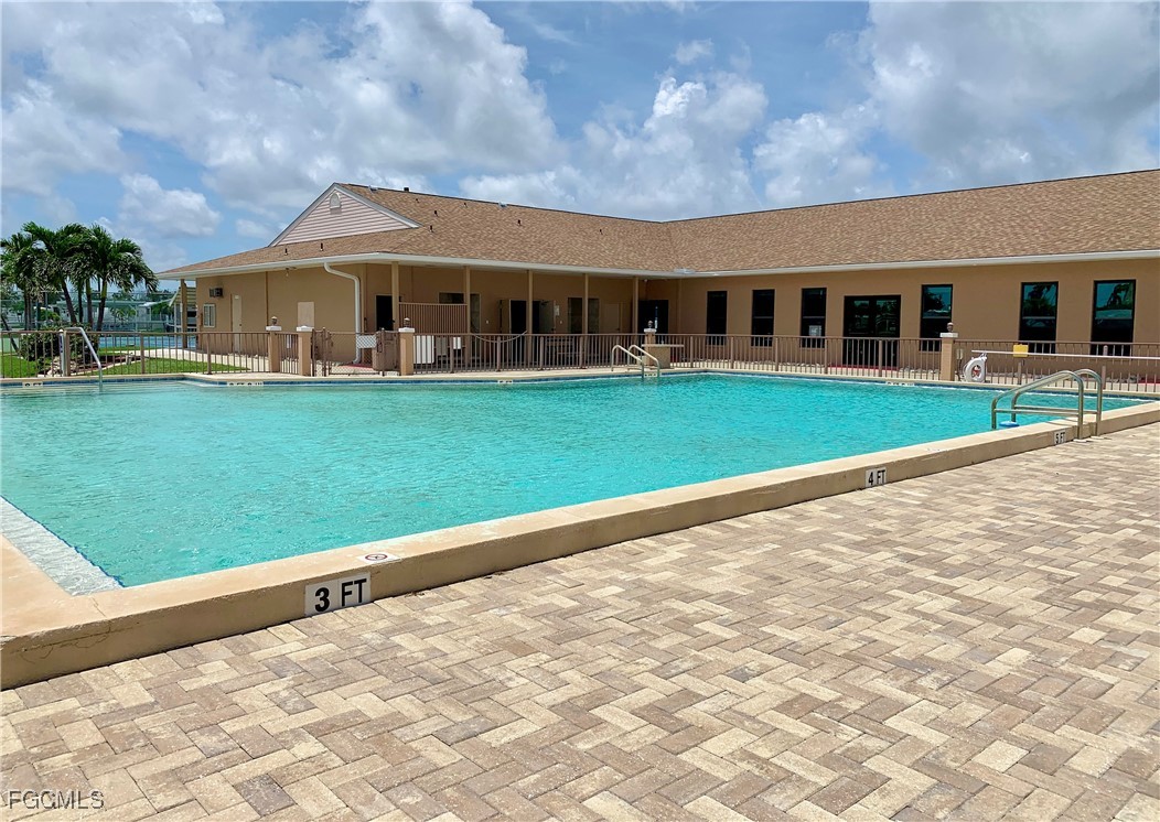 19681 Summerlin Road, Unit 273 Fort Myers, FL 33908 - Photo 10 of 16 a front view of a house with a garden