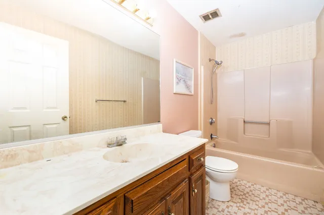 a picture of a wall with a white wall and a white refrigerator