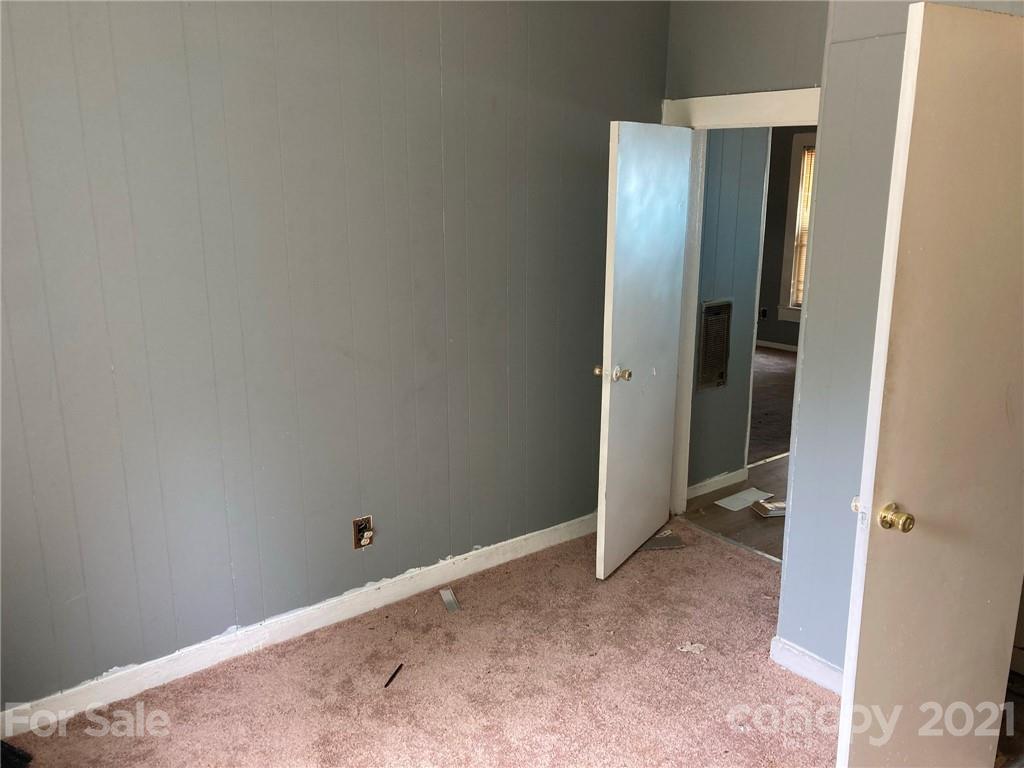 1005 Rickert Street Statesville, NC 28677 - Photo 6 of 10 an empty room with closet and mirror