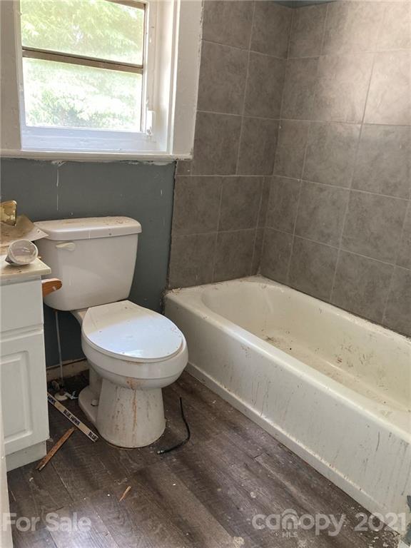 1005 Rickert Street Statesville, NC 28677 - Photo 7 of 10 a white toilet sitting next to a bath tub
