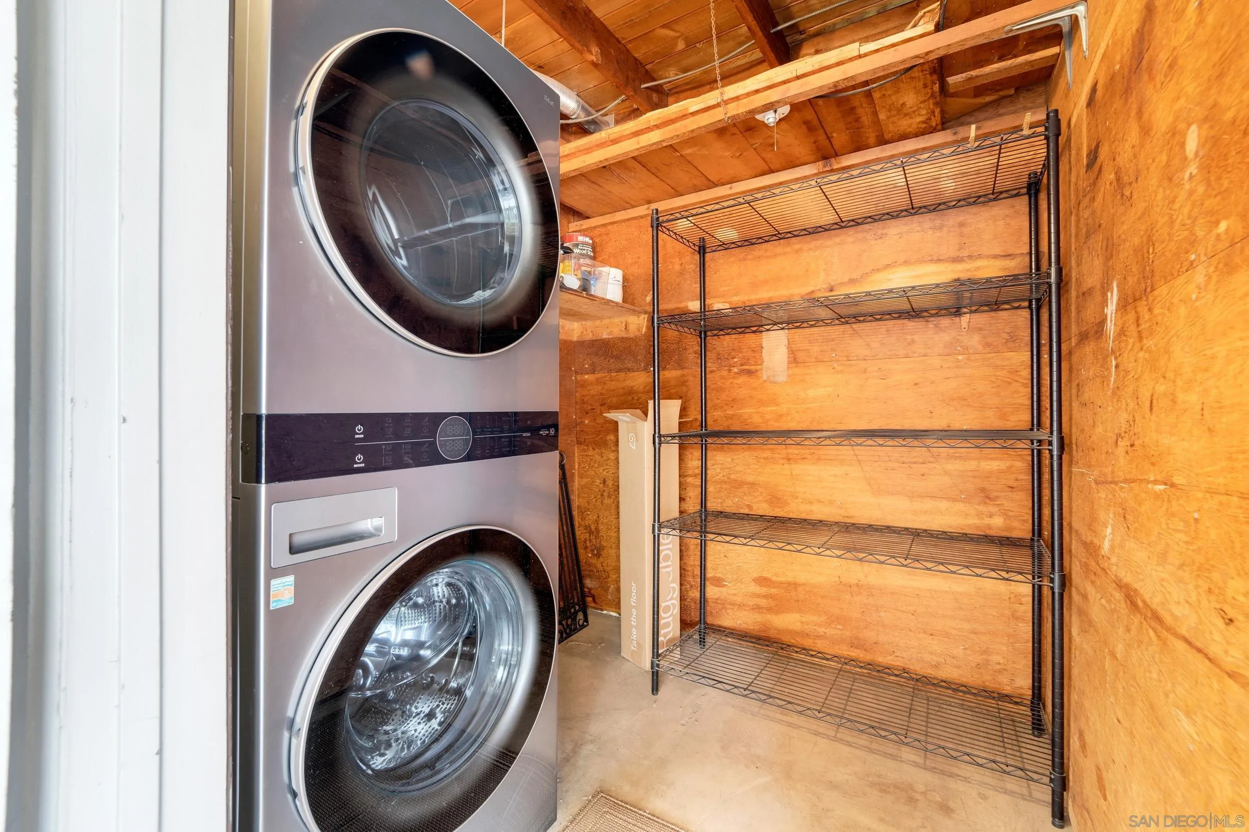 12424 Rios Road San Diego, CA 92128 - Photo 5 of 35 a view of livingroom with washer and dryer