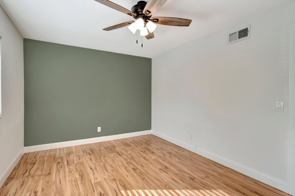 9932 Mission Vega Road, Unit 2 Santee, CA 92071 - Photo 15 of 28 wooden floor in an empty room