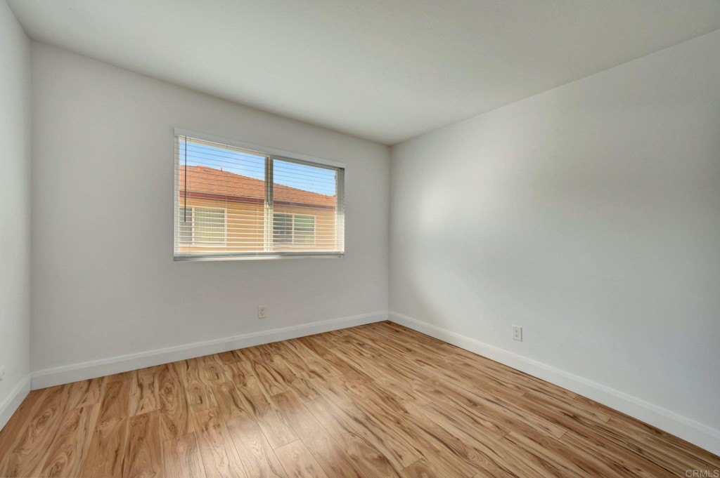 9932 Mission Vega Road, Unit 2 Santee, CA 92071 - Photo 17 of 28 wooden floor in an empty room with a window