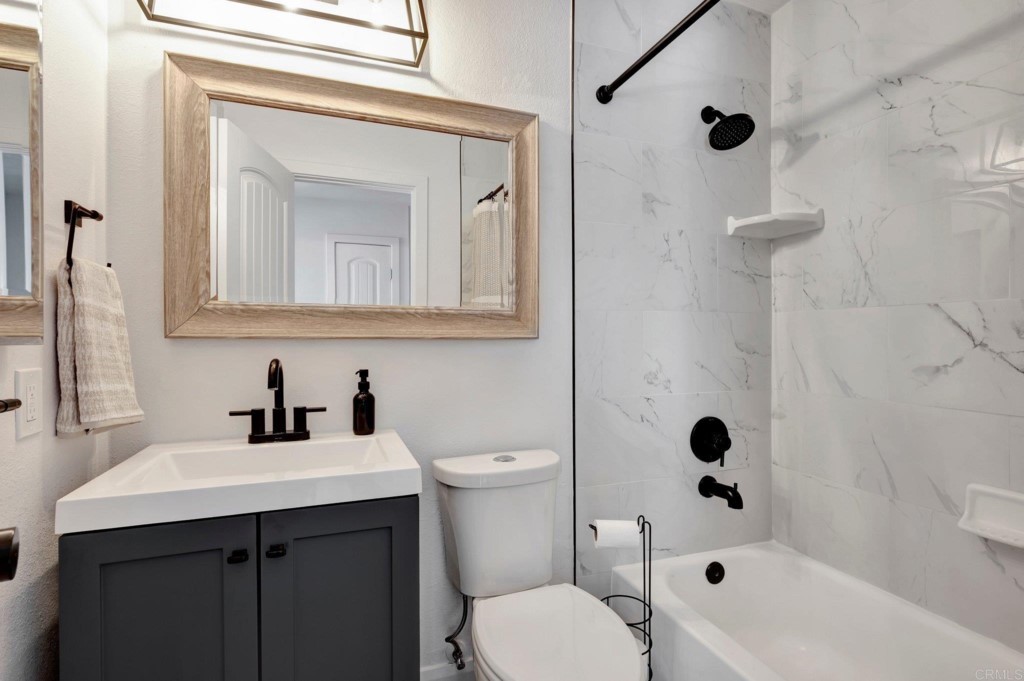 9932 Mission Vega Road, Unit 2 Santee, CA 92071 - Photo 20 of 28 a bathroom with a sink a toilet and shower