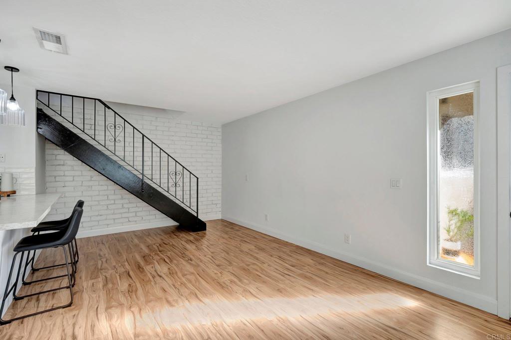 9932 Mission Vega Road, Unit 2 Santee, CA 92071 - Photo 8 of 28 a view of wooden floor and windows in a room