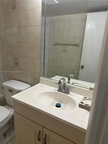 a bathroom with a sink and a toilet