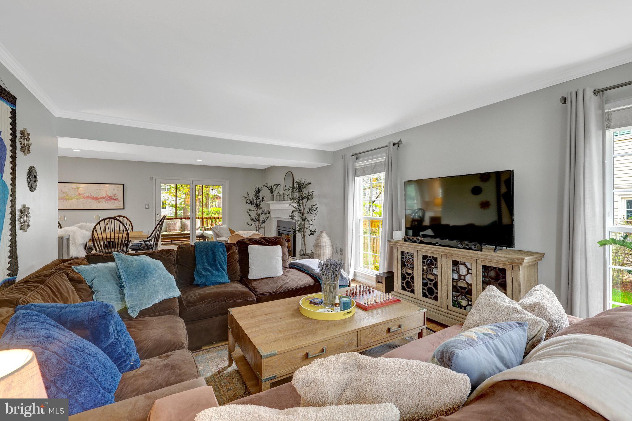 44116 Bristow Circle Ashburn, VA 20147 - Photo 14 of 79 a living room with furniture and a flat screen tv