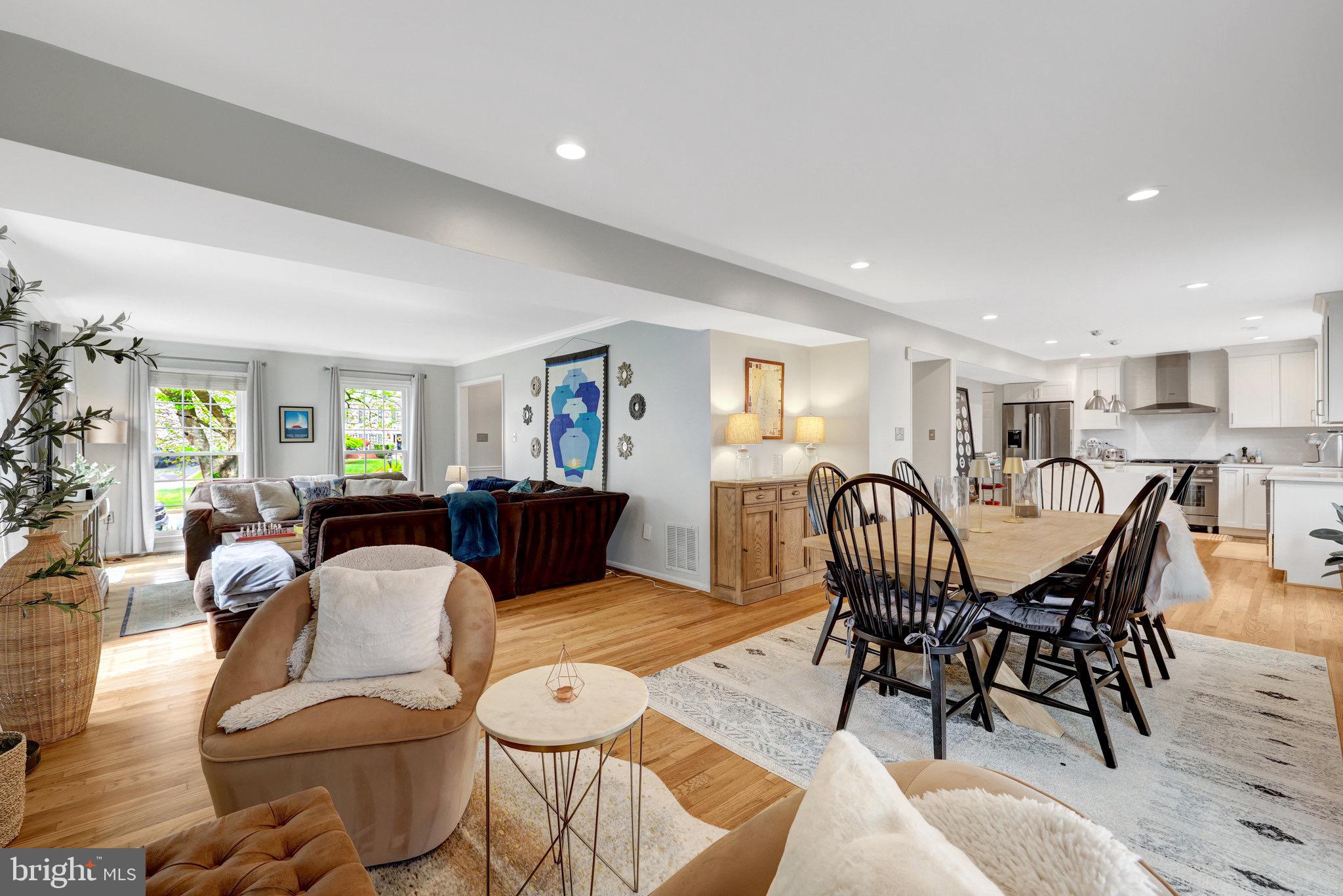 44116 Bristow Circle Ashburn, VA 20147 - Photo 15 of 79 a living room with furniture a dining table and wooden floor