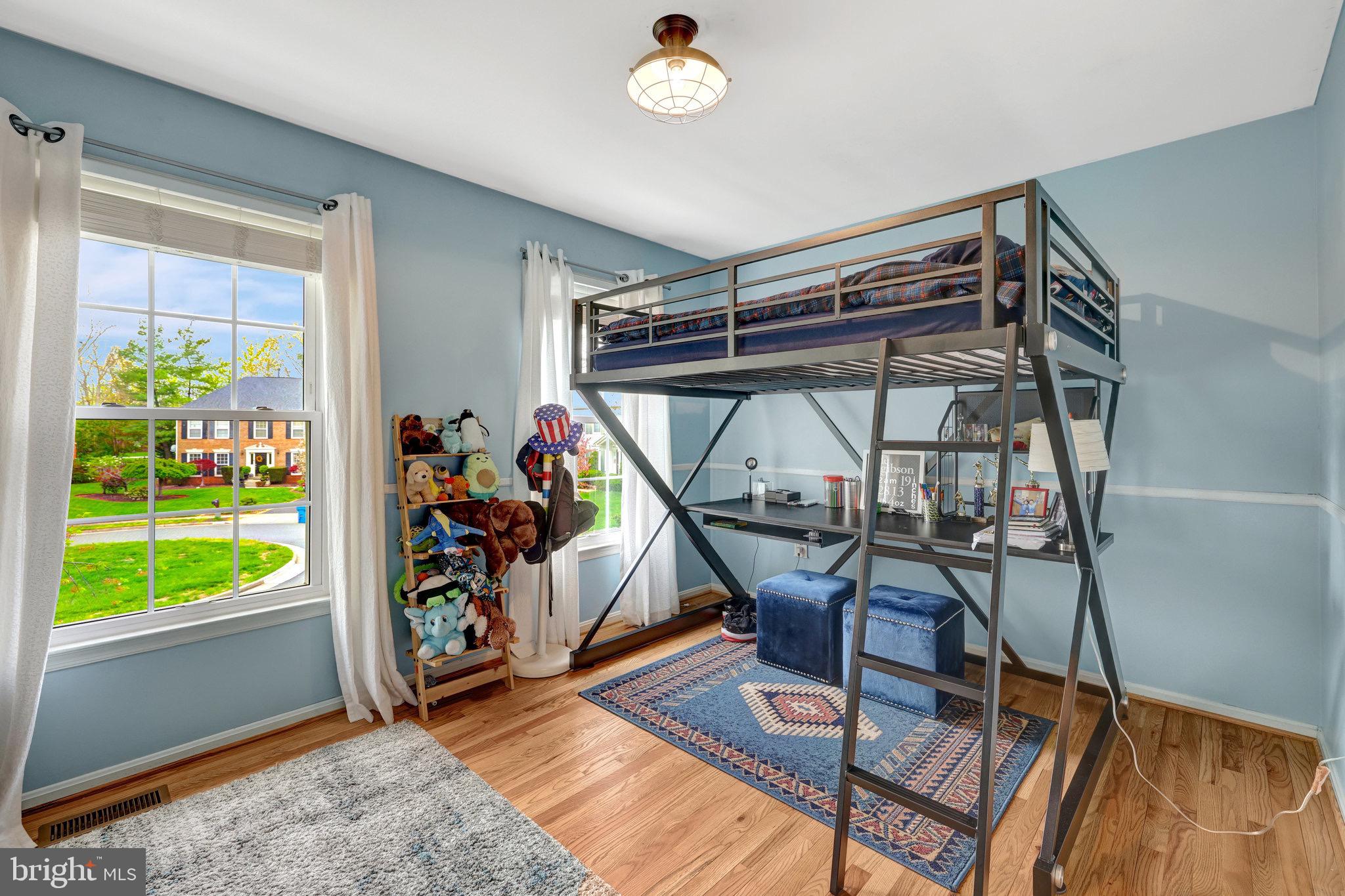 44116 Bristow Circle Ashburn, VA 20147 - Photo 45 of 79 a view of a room with gym equipment wooden floor and windows