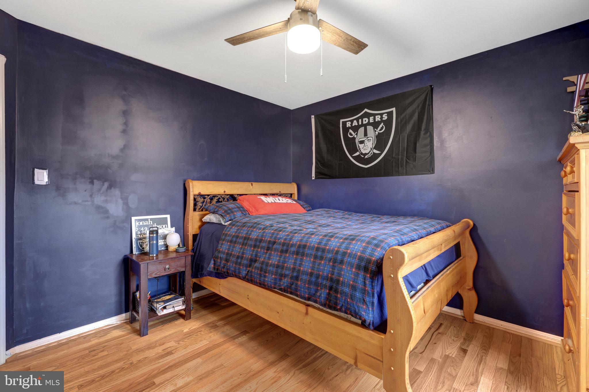 44116 Bristow Circle Ashburn, VA 20147 - Photo 47 of 79 a bedroom with a bed and a table in it