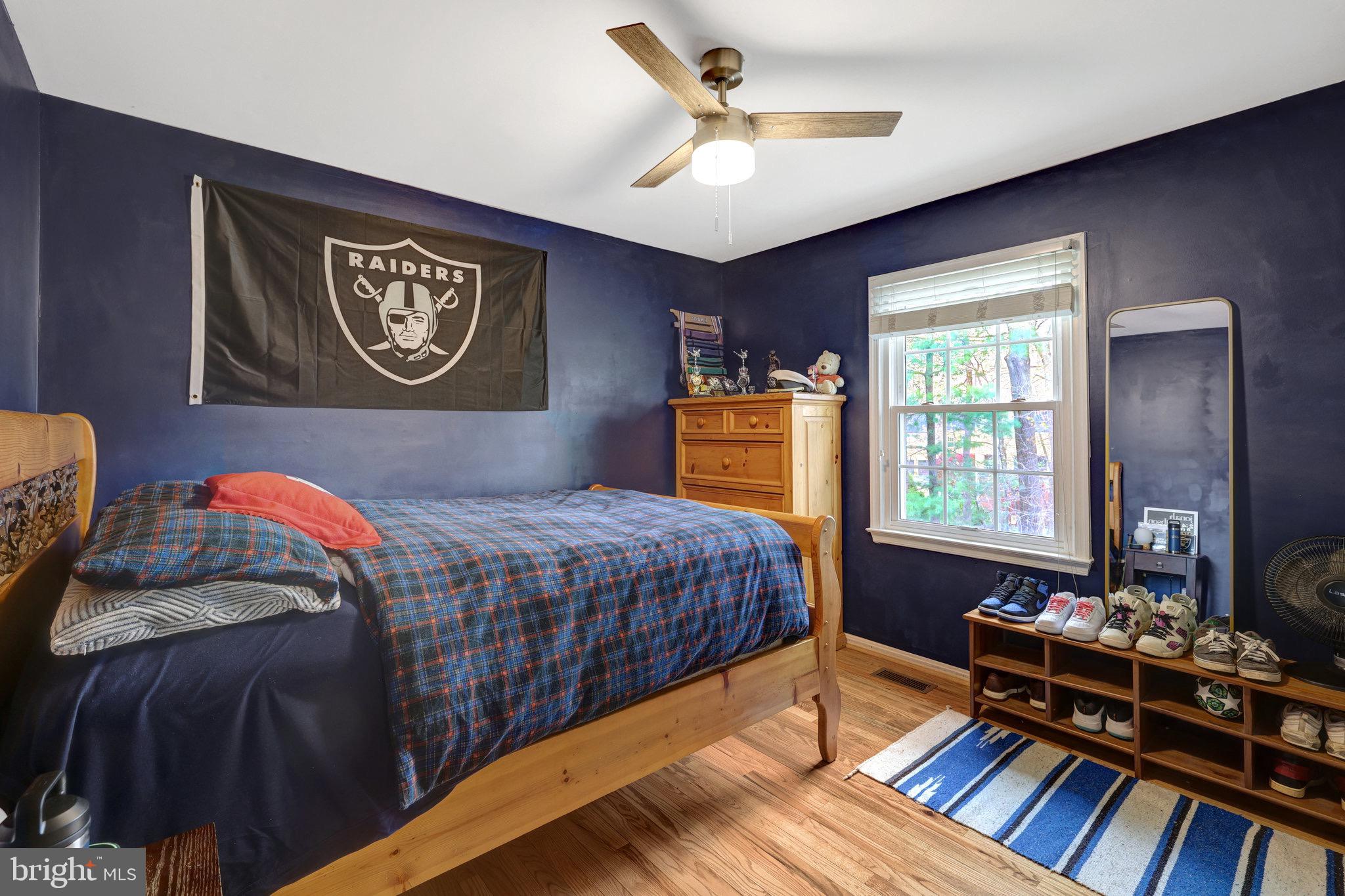 44116 Bristow Circle Ashburn, VA 20147 - Photo 48 of 79 a bedroom with a bed and a dresser next to a window