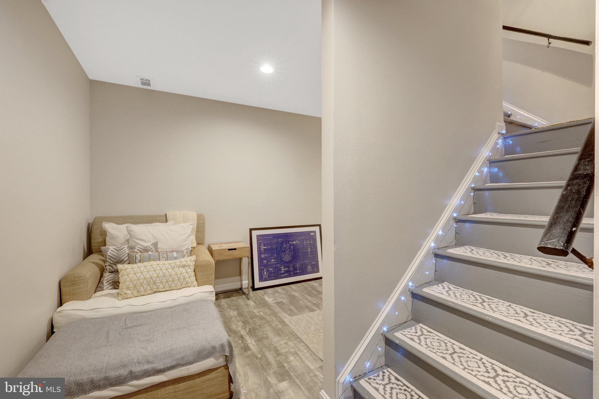 44116 Bristow Circle Ashburn, VA 20147 - Photo 51 of 79 a living room with furniture and a stairs