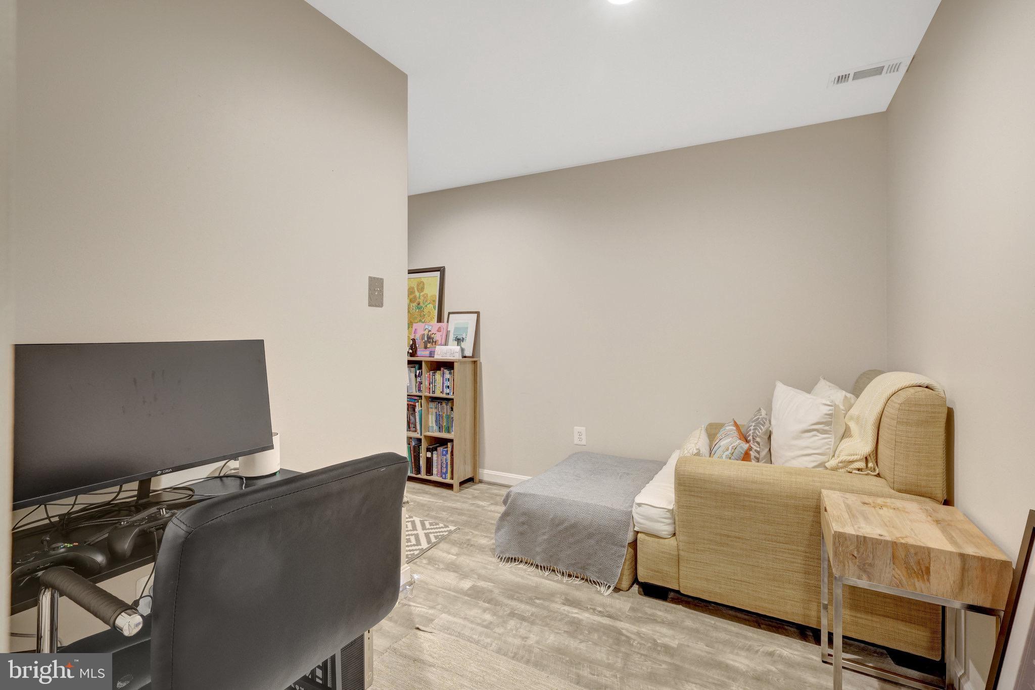 44116 Bristow Circle Ashburn, VA 20147 - Photo 54 of 79 a bedroom with a bed and a computer on the desk