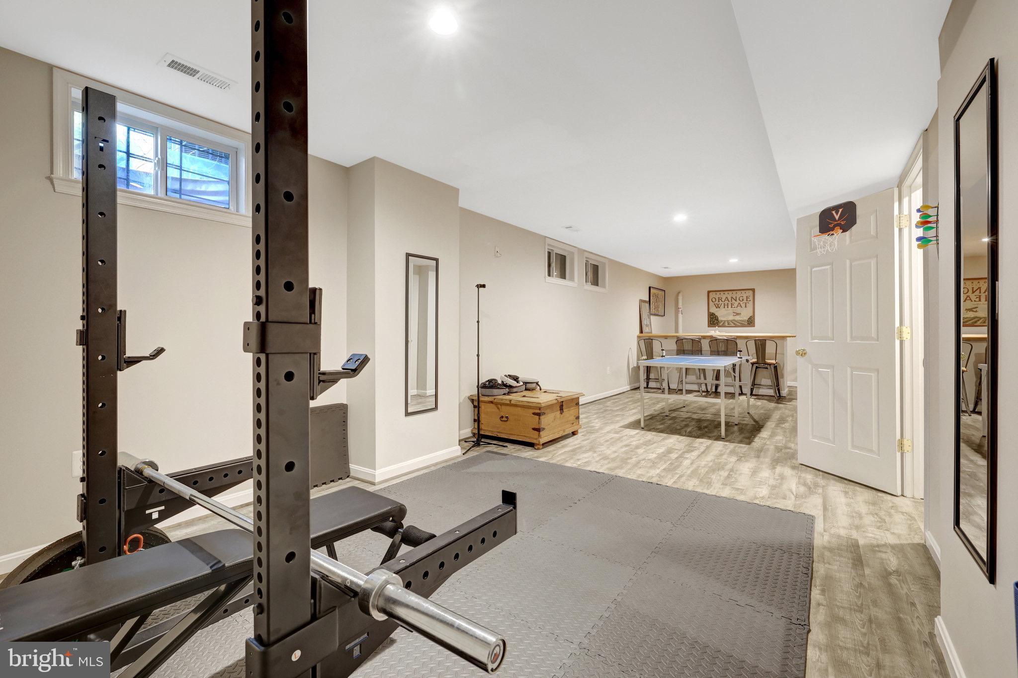 44116 Bristow Circle Ashburn, VA 20147 - Photo 58 of 79 a living room with furniture and a flat screen tv