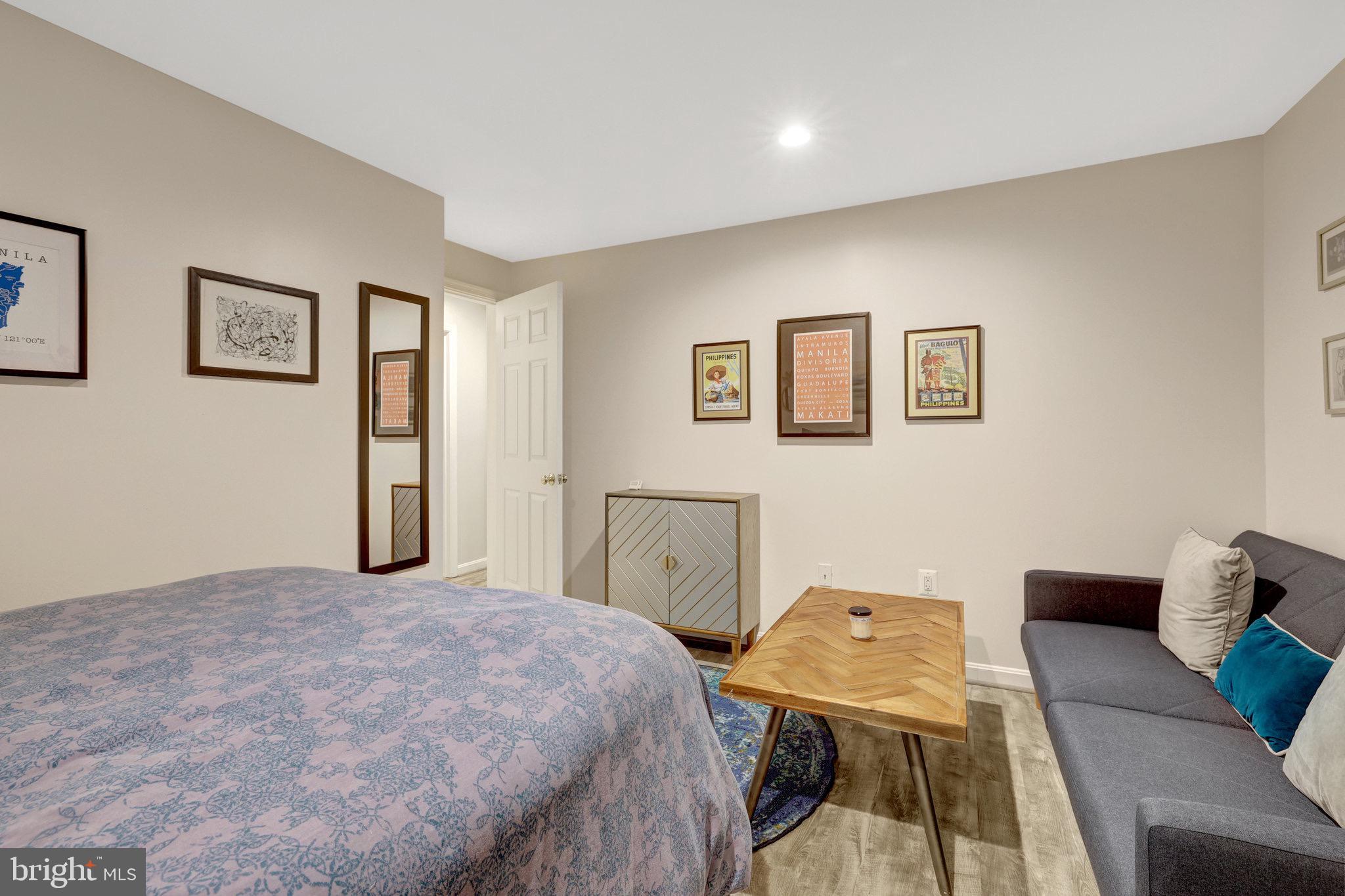 44116 Bristow Circle Ashburn, VA 20147 - Photo 62 of 79 a bedroom with a bed and furniture