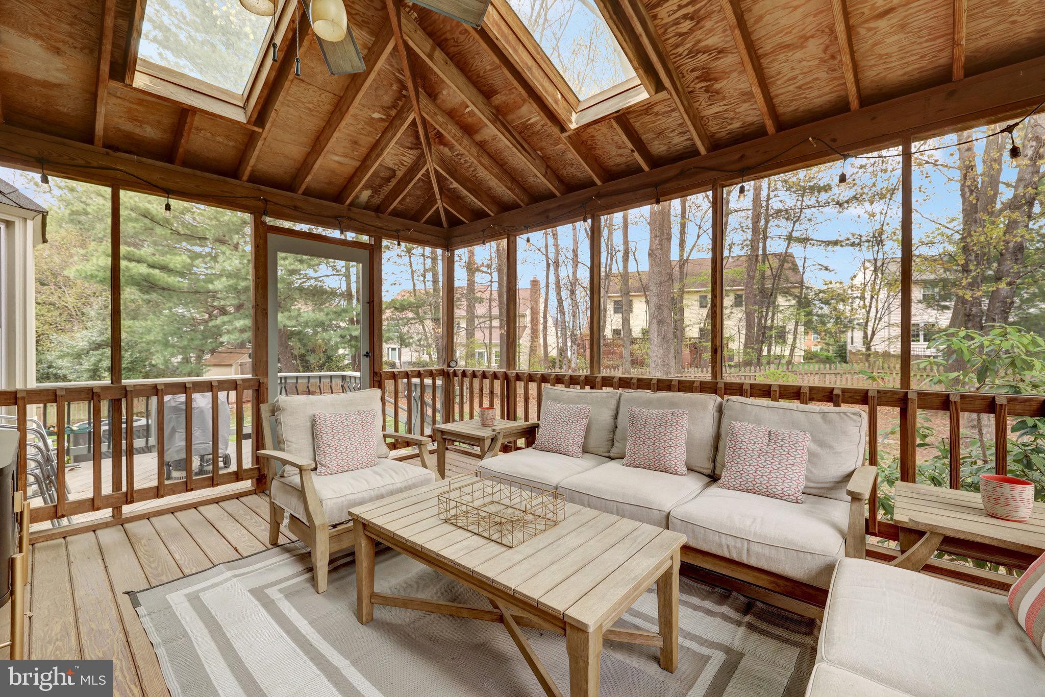 44116 Bristow Circle Ashburn, VA 20147 - Photo 65 of 79 a living room with furniture and a floor to ceiling window