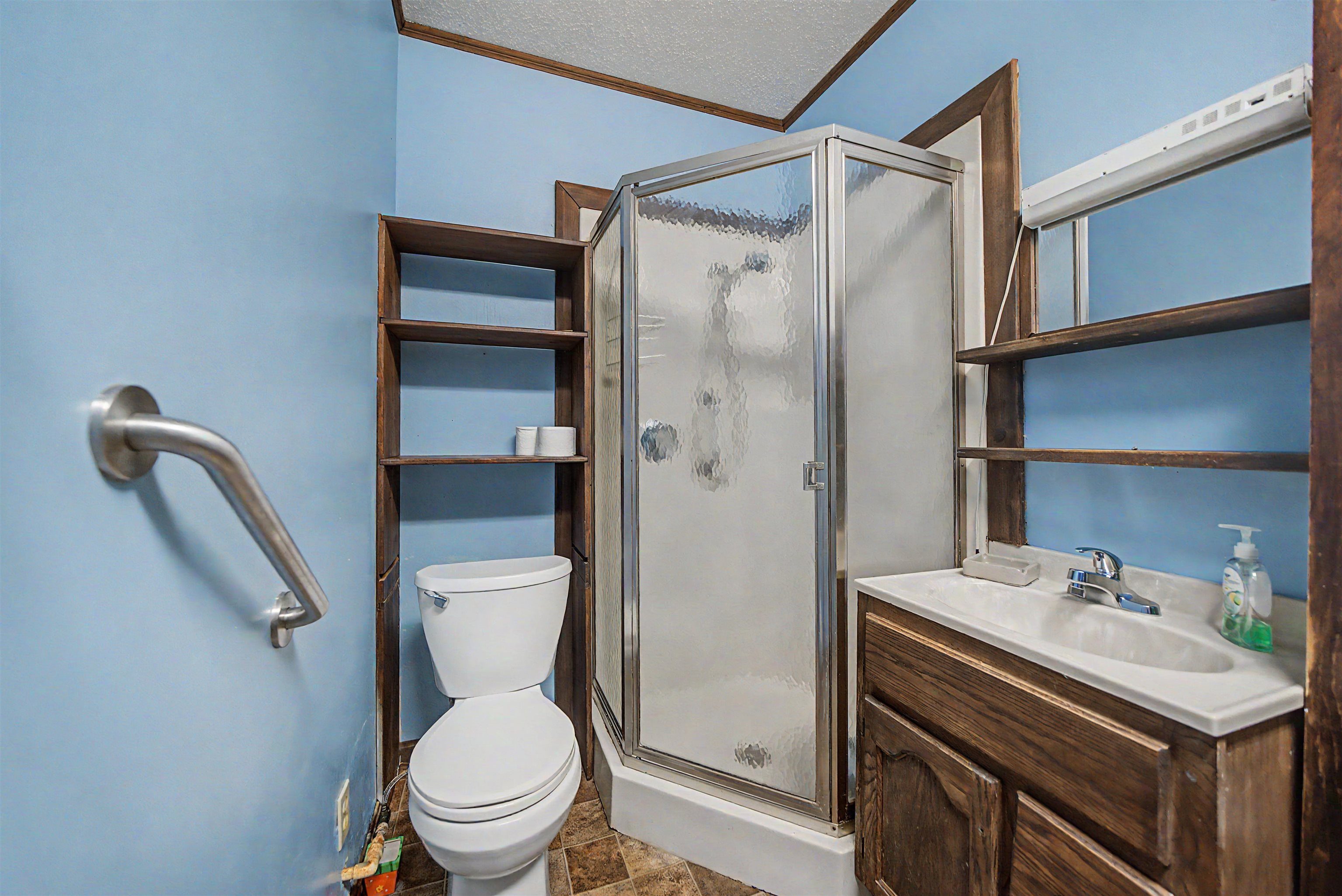 12 Baker Road Selmer, TN 38375 - Photo 21 of 28 a bathroom with a sink a toilet and shower