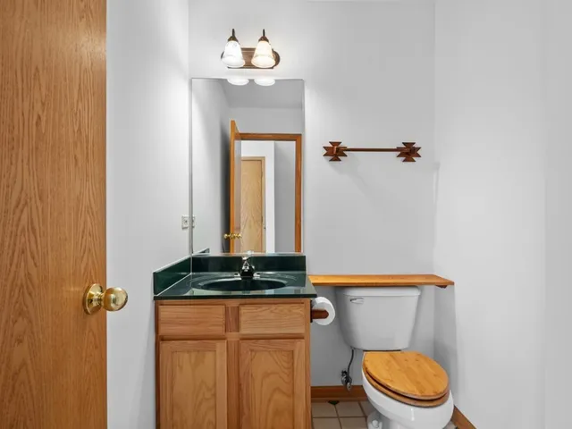 a bathroom with a toilet and a sink