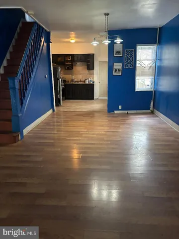 a view of a livingroom with a kitchen