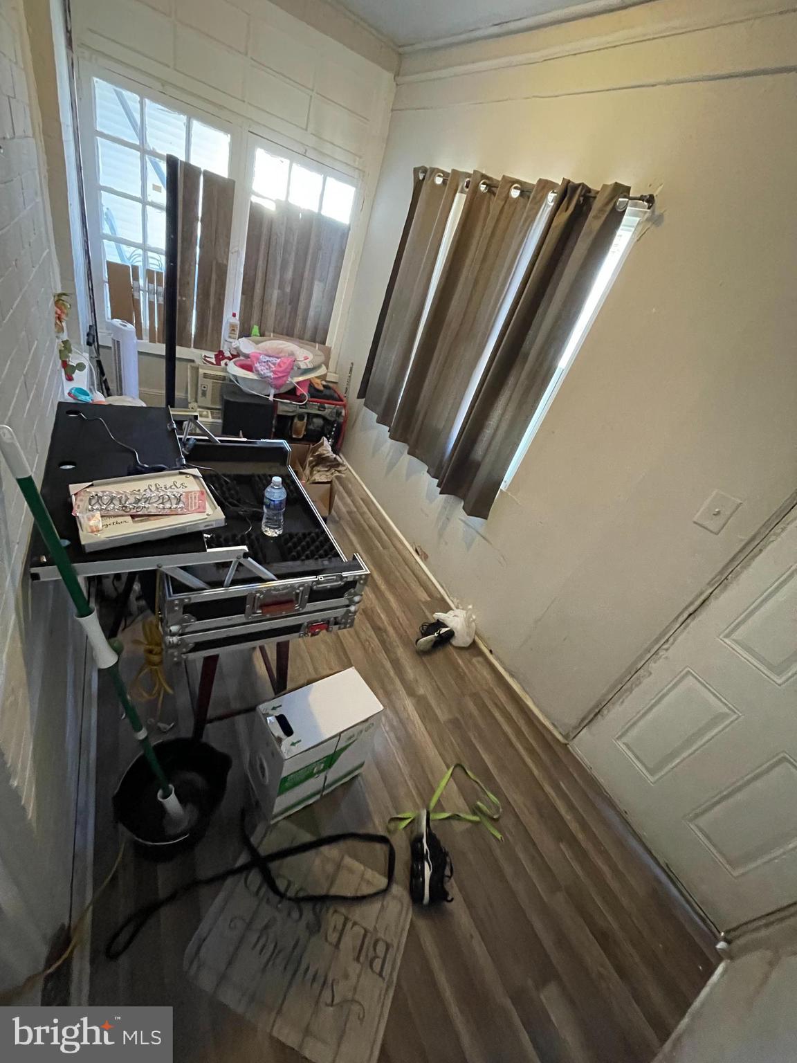 902 Maple Terrace Darby, PA 19023 - Photo 2 of 9 a view of a room with chairs and wooden floor