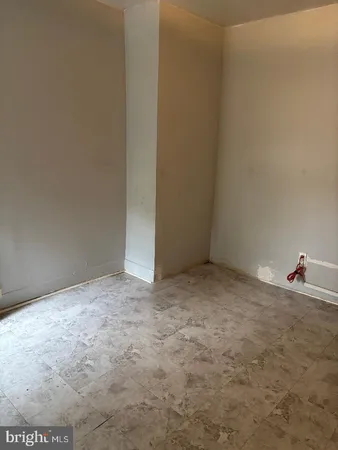 a bathroom with a shower and a sink