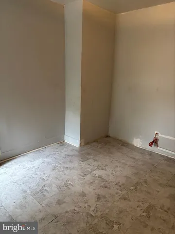 a bathroom with a shower and a sink