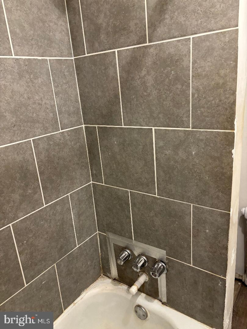 902 Maple Terrace Darby, PA 19023 - Photo 7 of 9 a bathroom with a shower and a sink