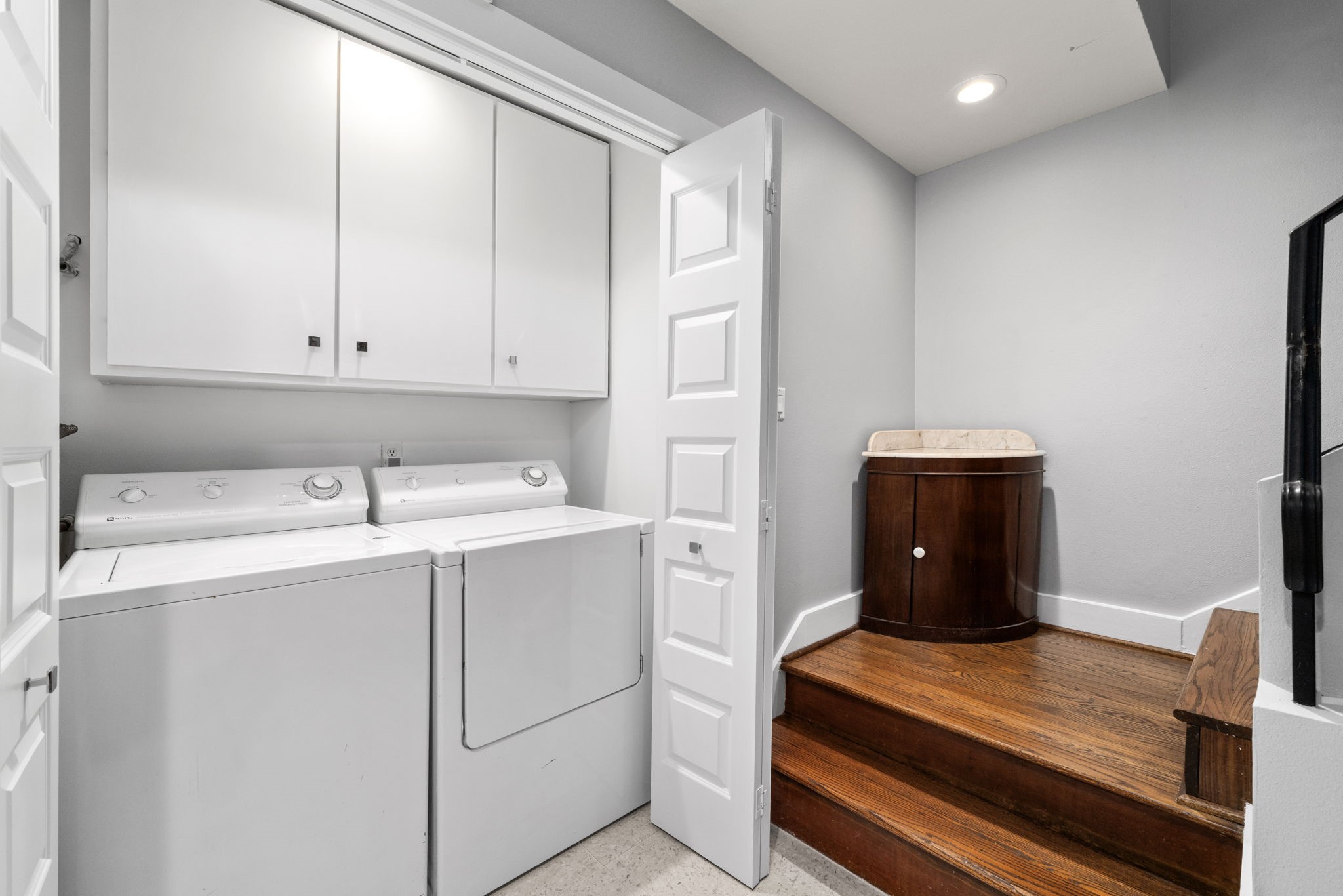 1011 Barkdull Street Houston, TX 77006 - Photo 17 of 40 Laundry is located on the first floor, behind folding door to conceal from guests as they go upstairs to the living space.