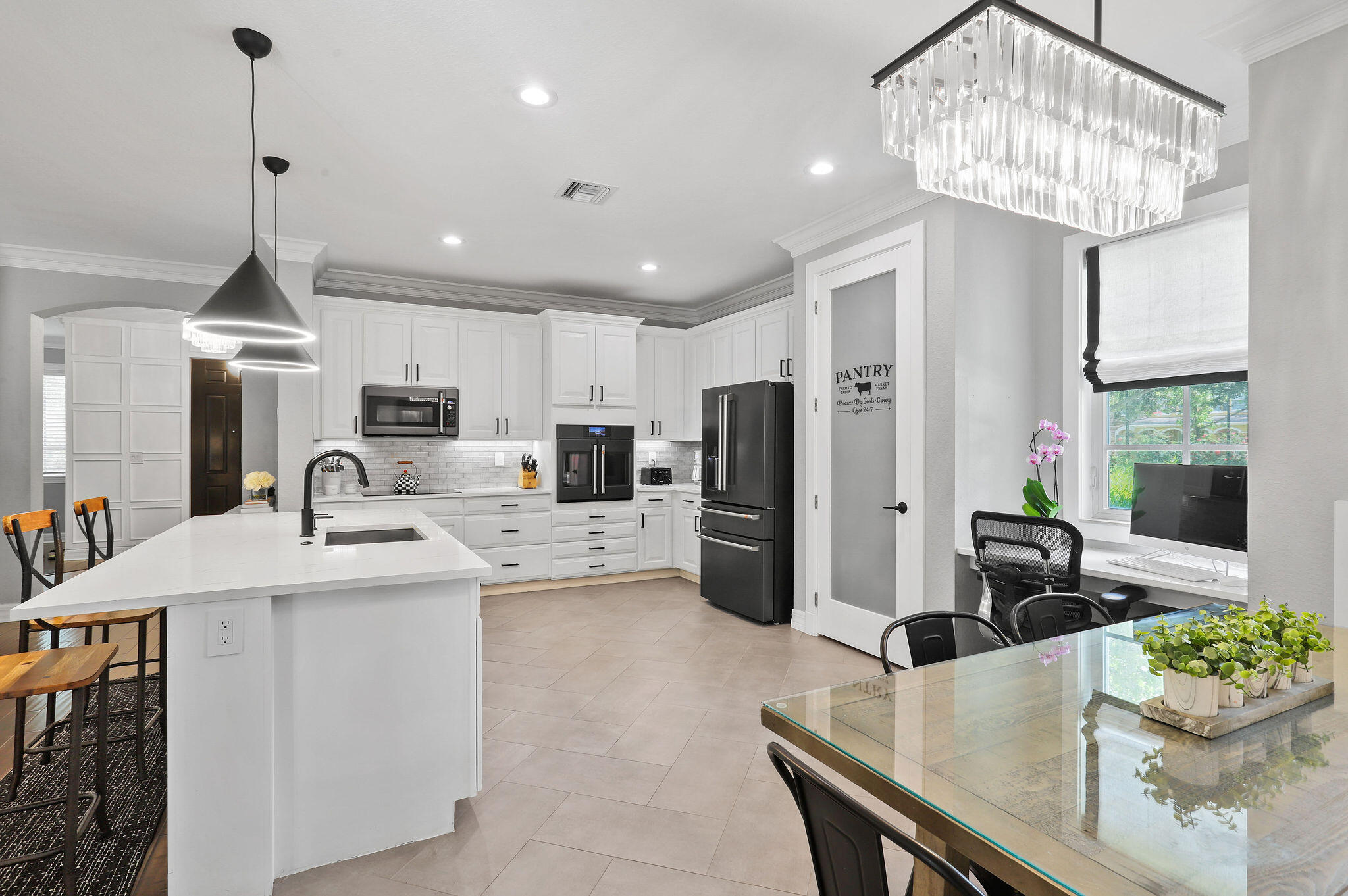 147 Killarney Court Jupiter, FL 33458 - Photo 14 of 68 a kitchen with stainless steel appliances granite countertop a sink a refrigerator and a stove top oven