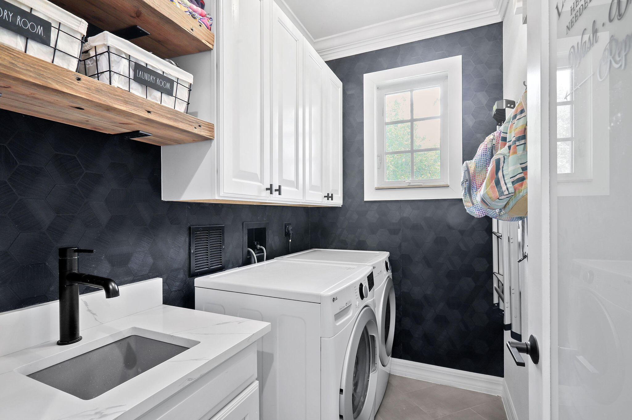 147 Killarney Court Jupiter, FL 33458 - Photo 18 of 68 a utility room with dryer and washer