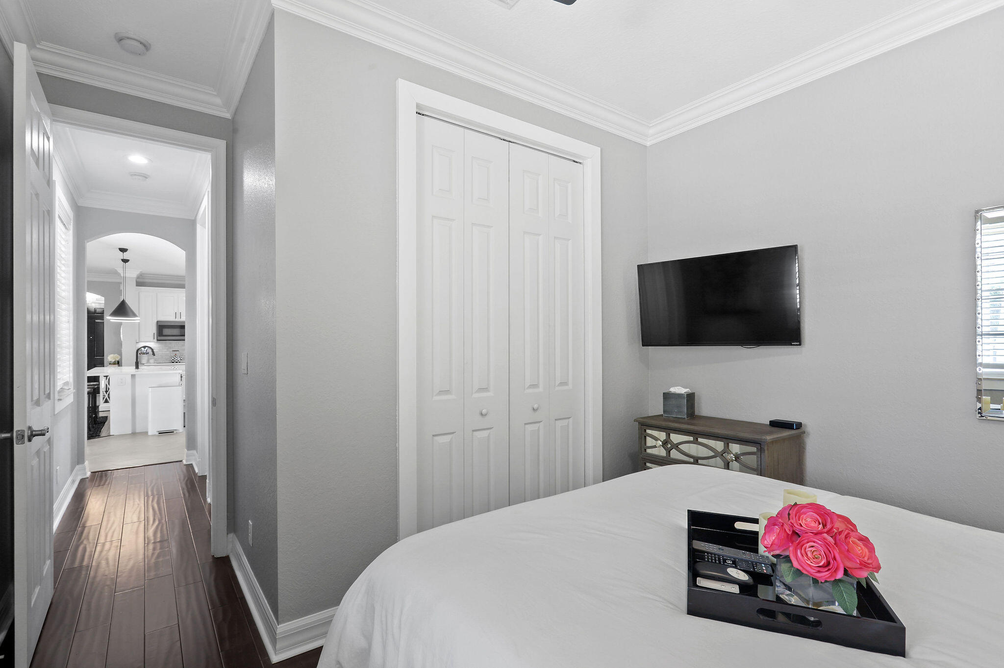 147 Killarney Court Jupiter, FL 33458 - Photo 21 of 68 a bedroom with a bed and a flat screen tv