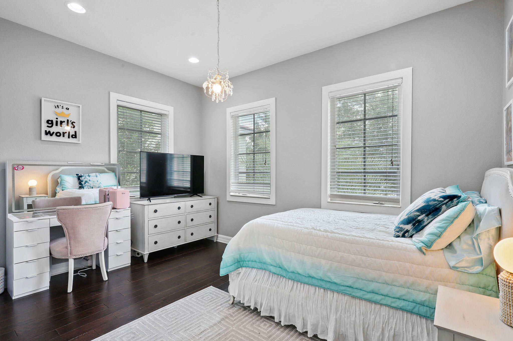 147 Killarney Court Jupiter, FL 33458 - Photo 23 of 68 a bedroom with bed tv and window