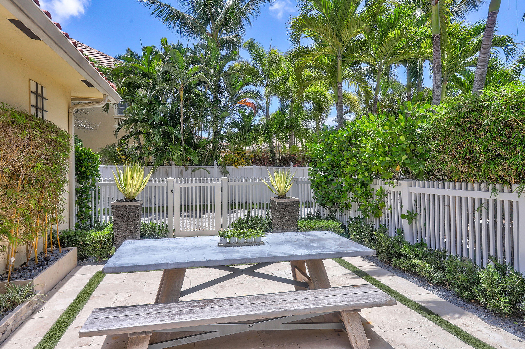 147 Killarney Court Jupiter, FL 33458 - Photo 43 of 68 a view of a backyard with sitting area