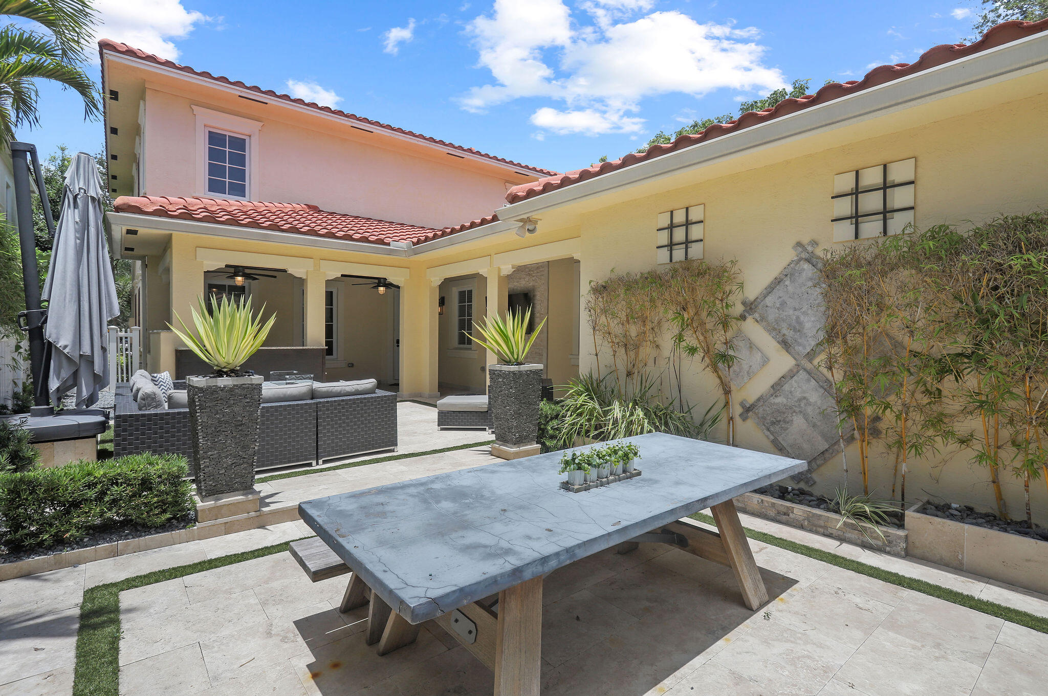 147 Killarney Court Jupiter, FL 33458 - Photo 44 of 68 a terrace of a house with outdoor seating