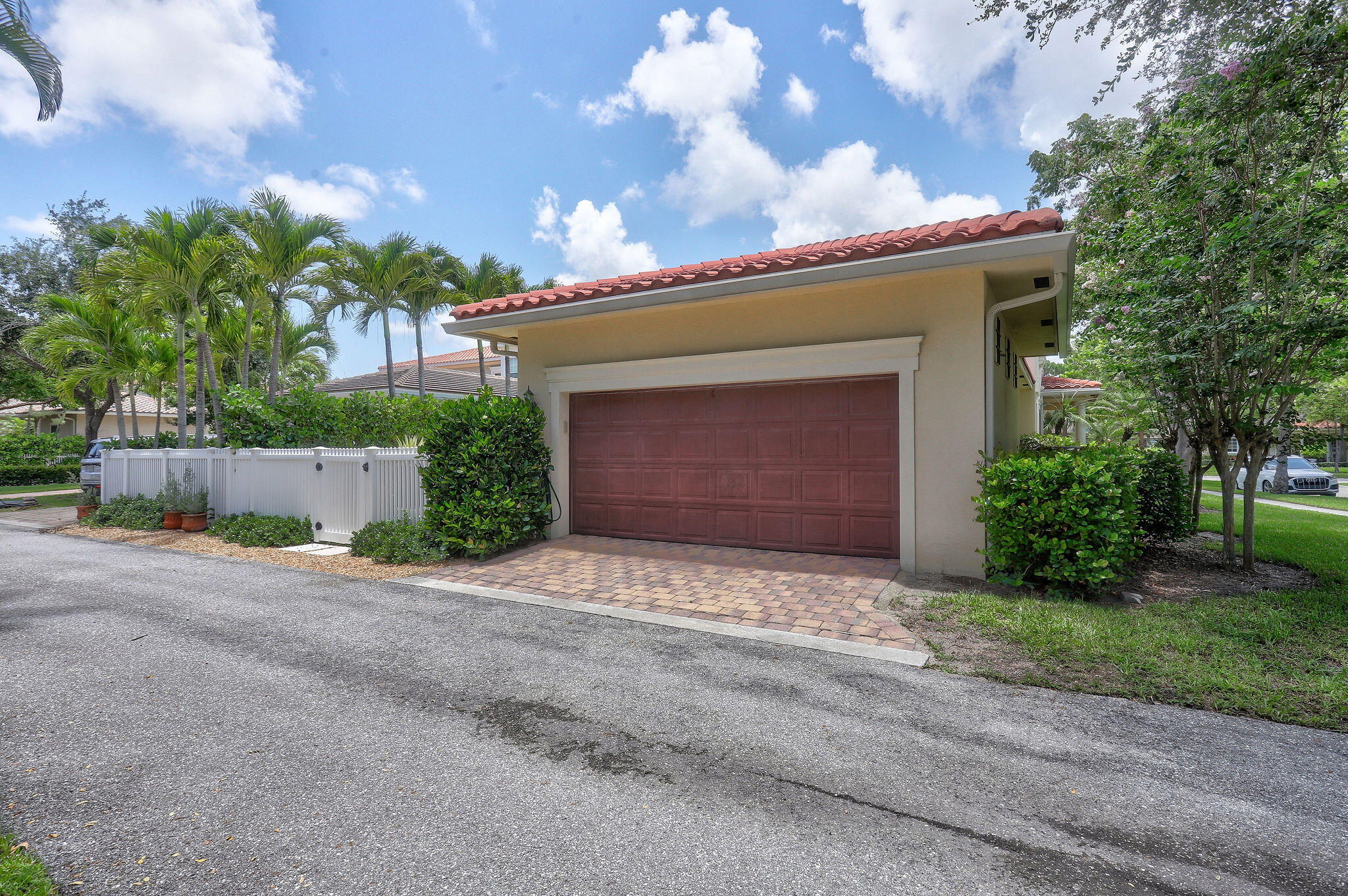 147 Killarney Court Jupiter, FL 33458 - Photo 48 of 68 a front view of a house with a yard and garage