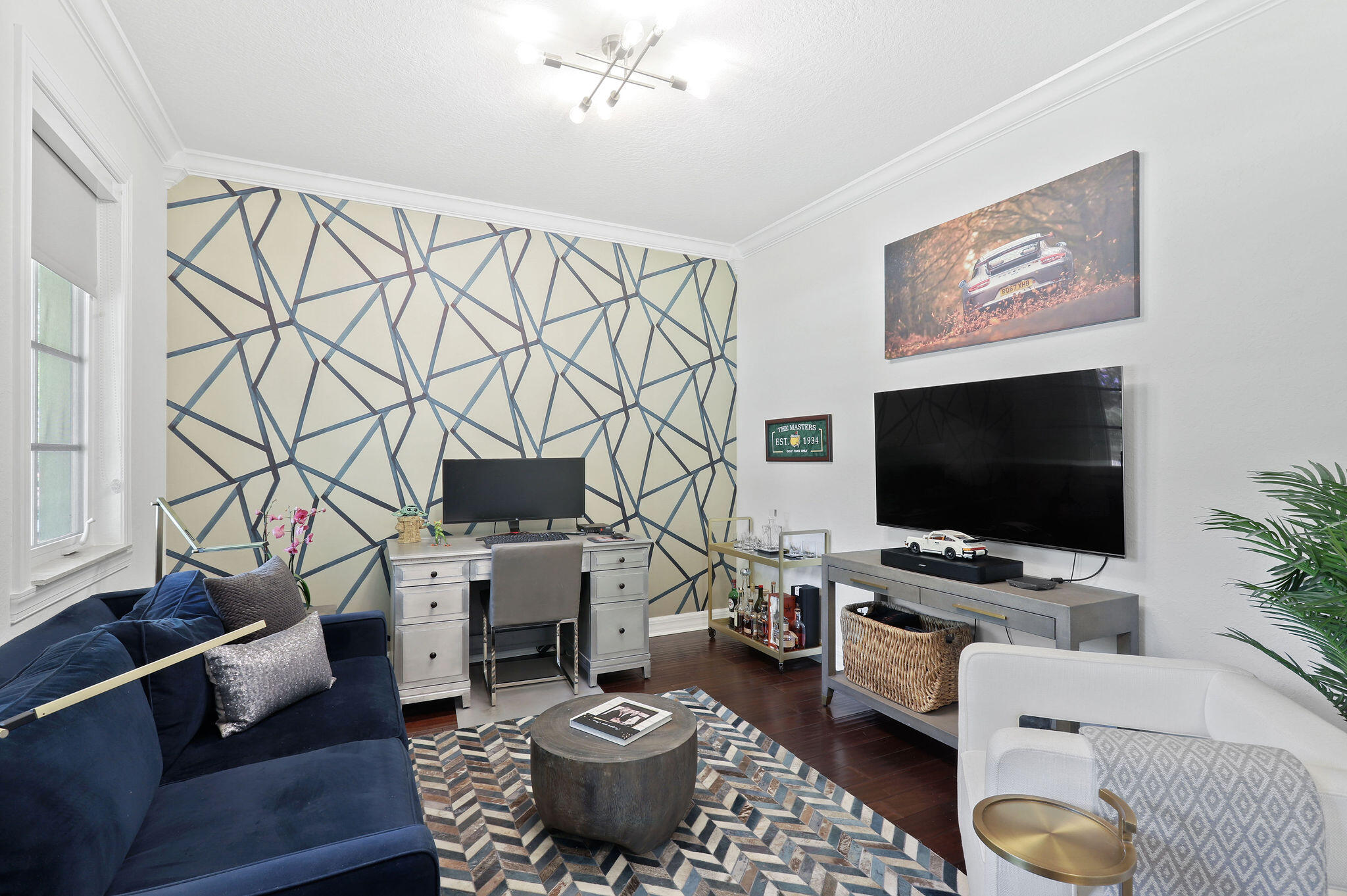 147 Killarney Court Jupiter, FL 33458 - Photo 6 of 68 a living room with furniture and a flat screen tv