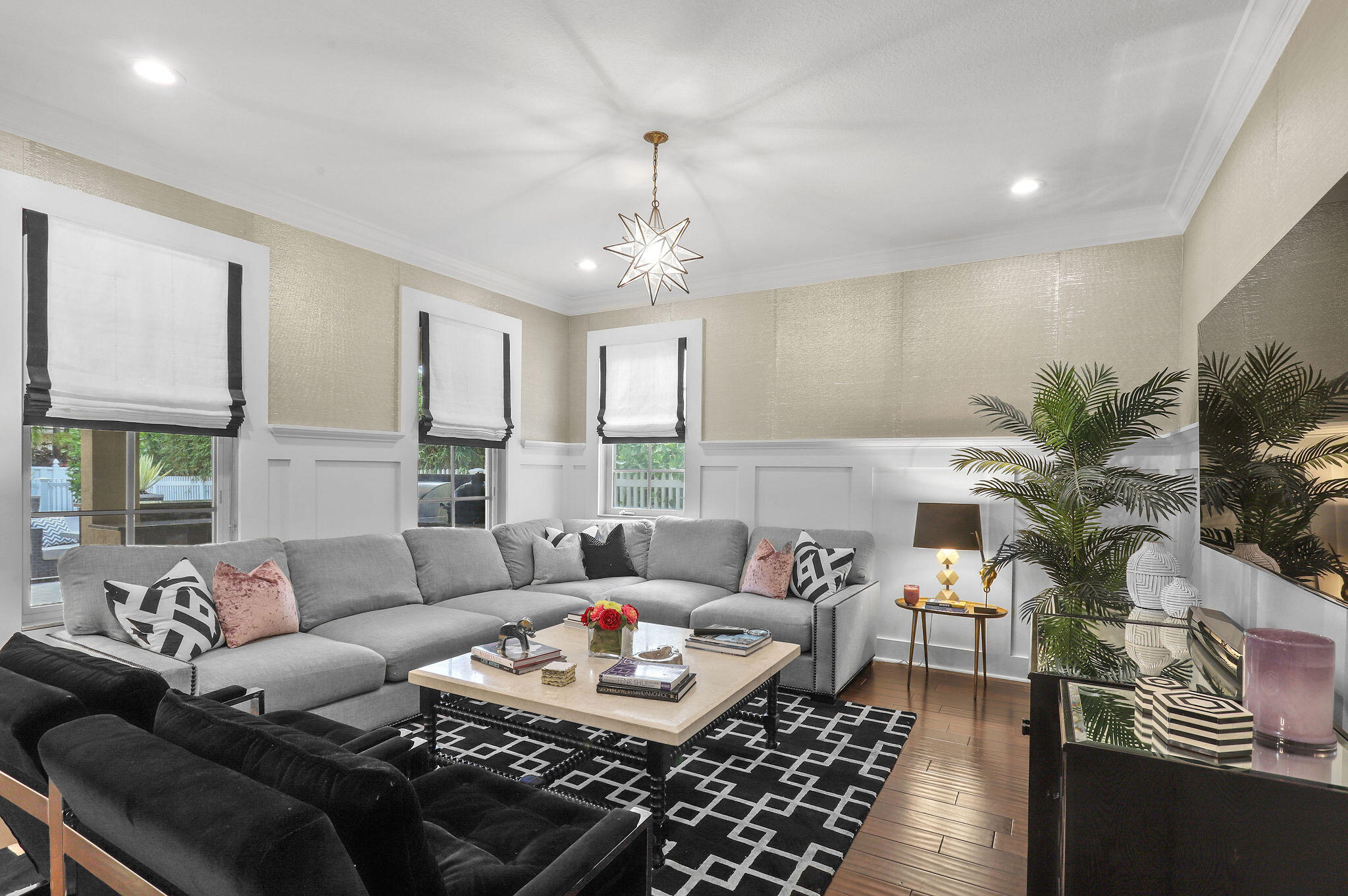 147 Killarney Court Jupiter, FL 33458 - Photo 9 of 68 a living room with furniture and a large window