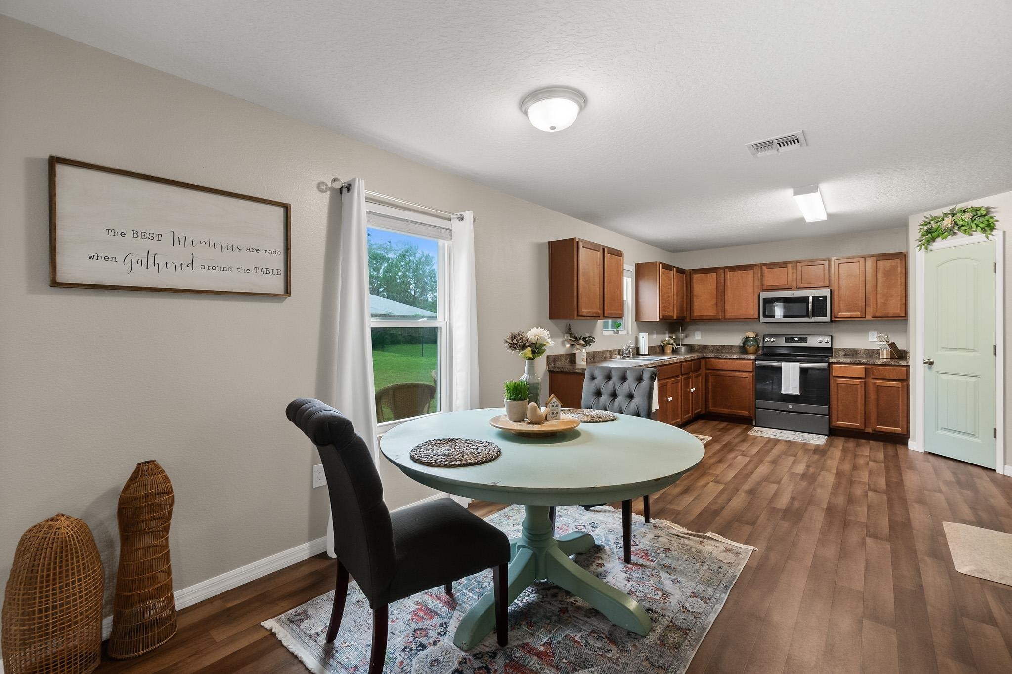 10 Pickcane Lane Palm Coast, FL 32164 - Photo 14 of 43 a view of a dining room with furniture window and wooden floor