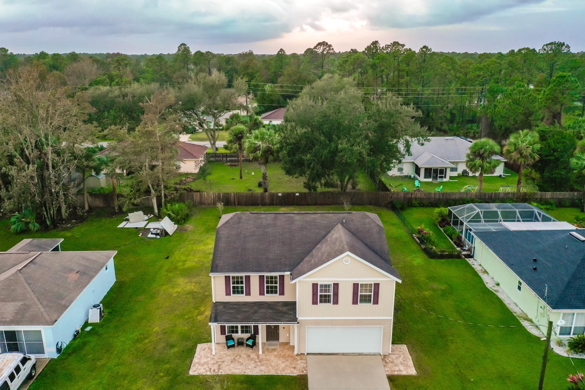 10 Pickcane Lane Palm Coast, FL 32164 - Photo 2 of 43 an aerial view of residential houses with outdoor space and trees