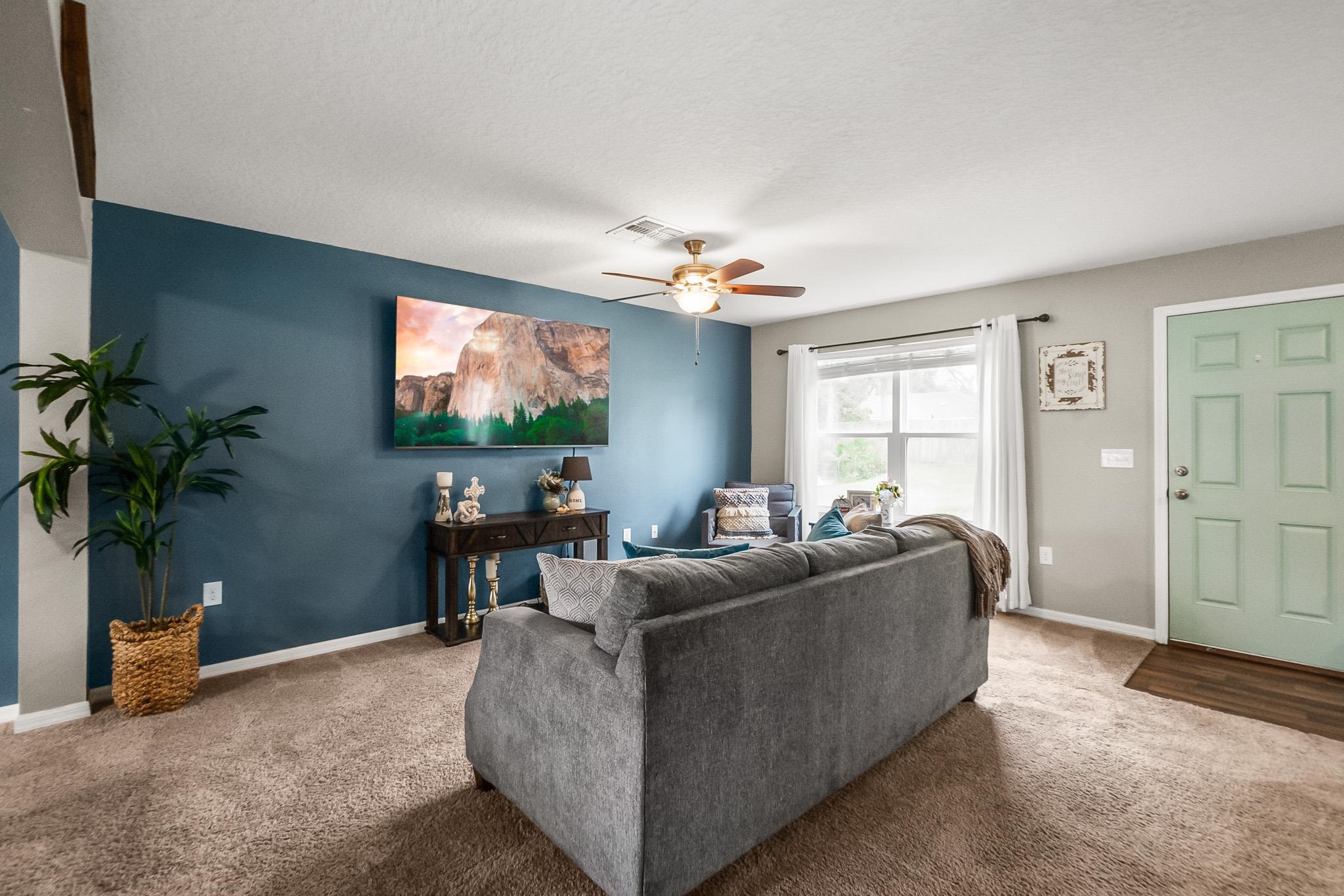 10 Pickcane Lane Palm Coast, FL 32164 - Photo 10 of 43 a living room with furniture and a flat screen tv