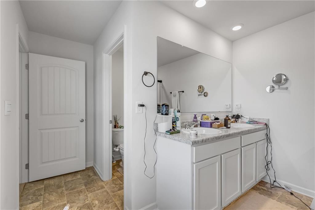 575 Walnut Grv Way Pendergrass, GA 30567 - Photo 27 of 39 a bathroom with a sink toilet and vanity