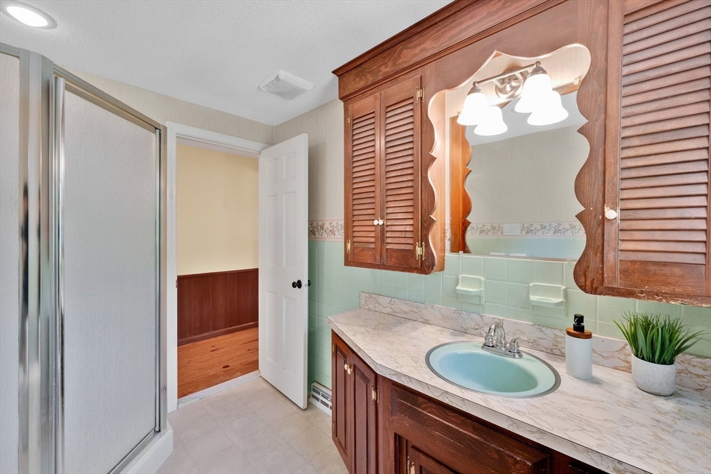 3 Mark Road Wilbraham, MA 01095 - Photo 28 of 39 a bathroom with a granite countertop sink and a mirror