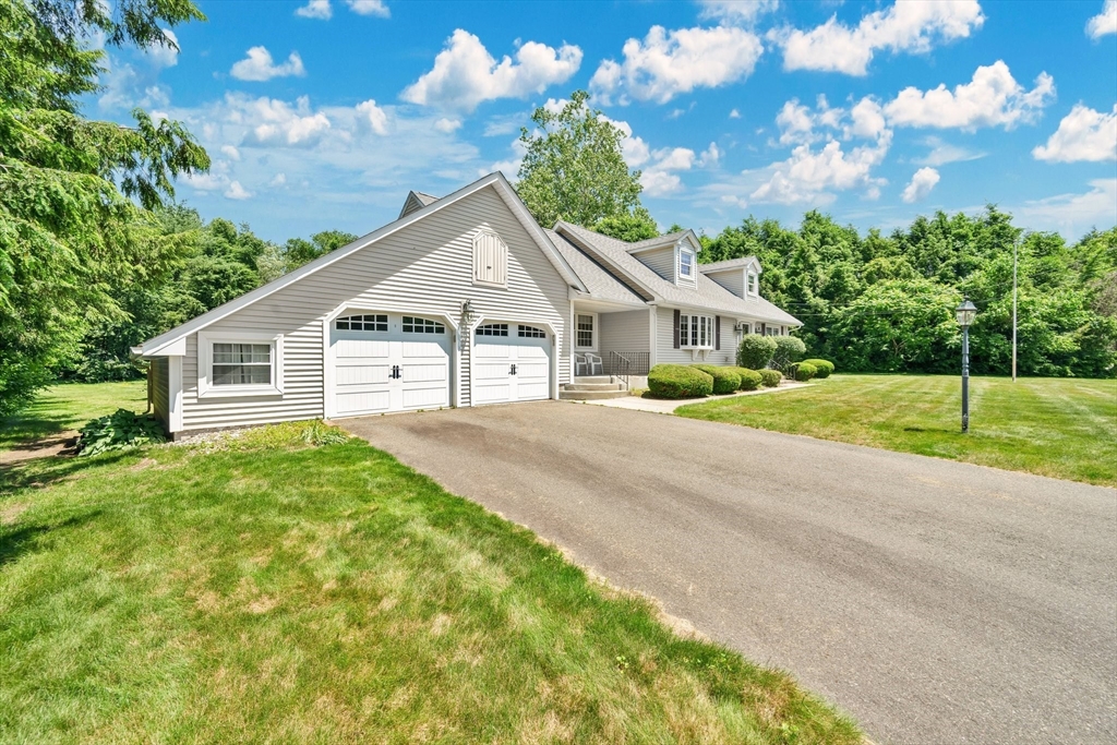 3 Mark Road Wilbraham, MA 01095 - Photo 38 of 39 a view of a house with a yard and potted plants