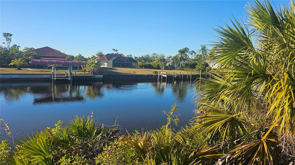 1253 Casper Street Port Charlotte, FL 33953 - Photo 12 of 13 a view of a lake with houses