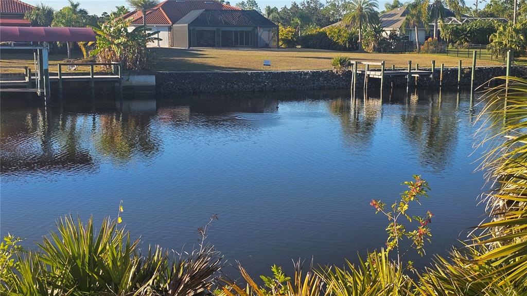 1253 Casper Street Port Charlotte, FL 33953 - Photo 3 of 13 a view of swimming pool with a lake view