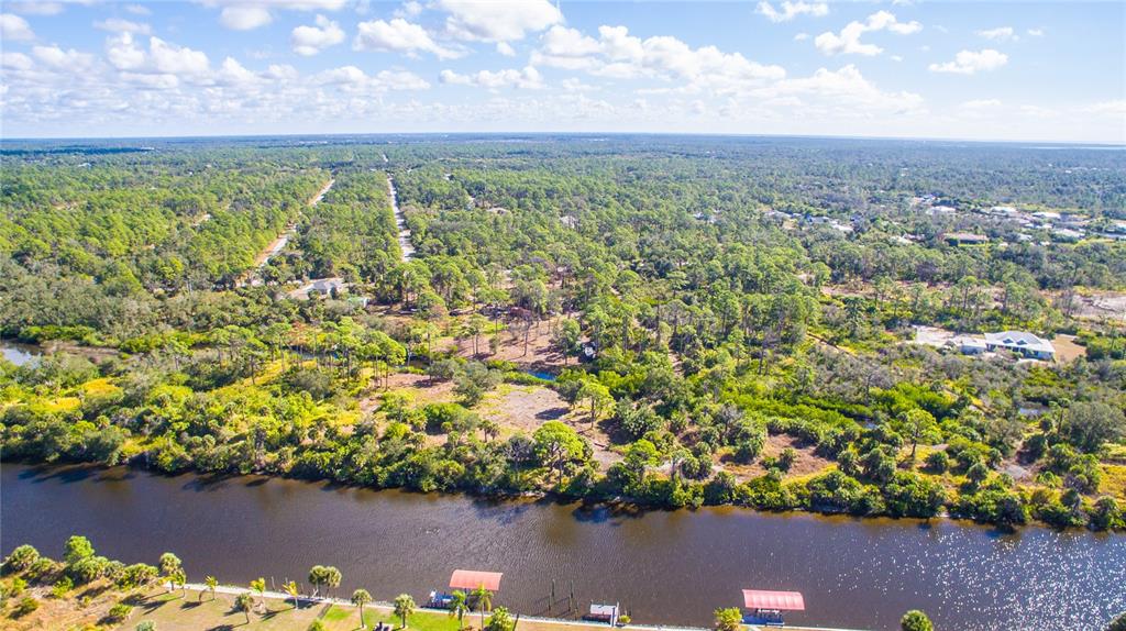 1253 Casper Street Port Charlotte, FL 33953 - Photo 7 of 13 a view of a lake with a city