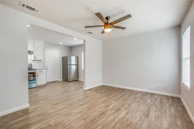 a view of a kitchen with a sink and a window
